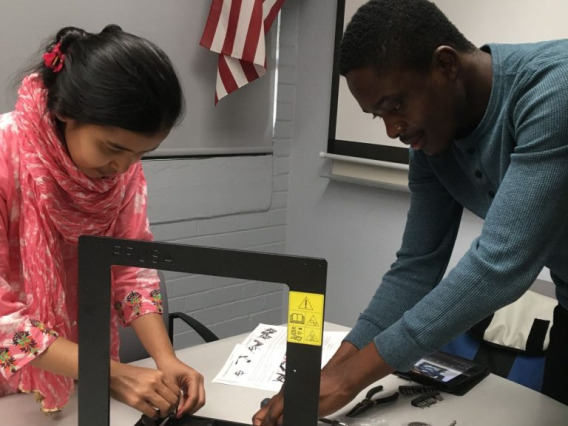  Fig.1. Setting up a new 3D printer in the lab for sustainability research.