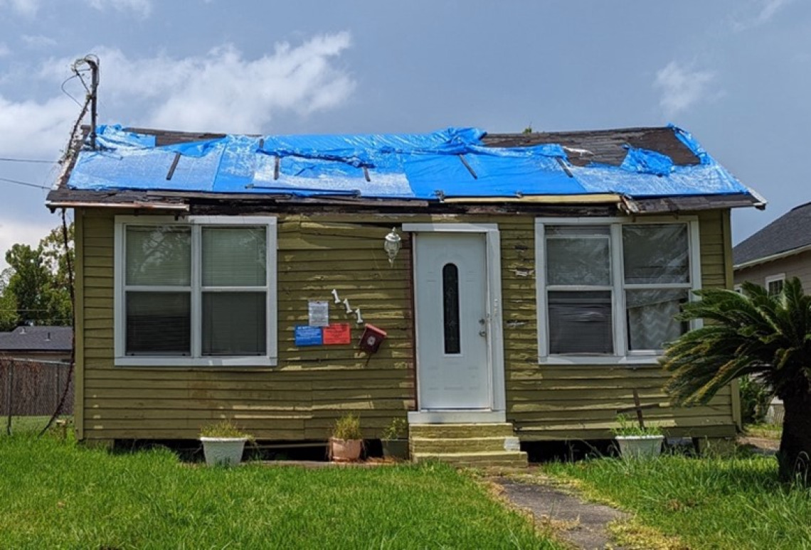 Photo of blue tarp on a home in North Lake Charles in August 2022. 
