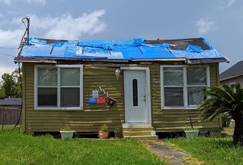 Blue tarp on a home in North Lake Charles in August 2022