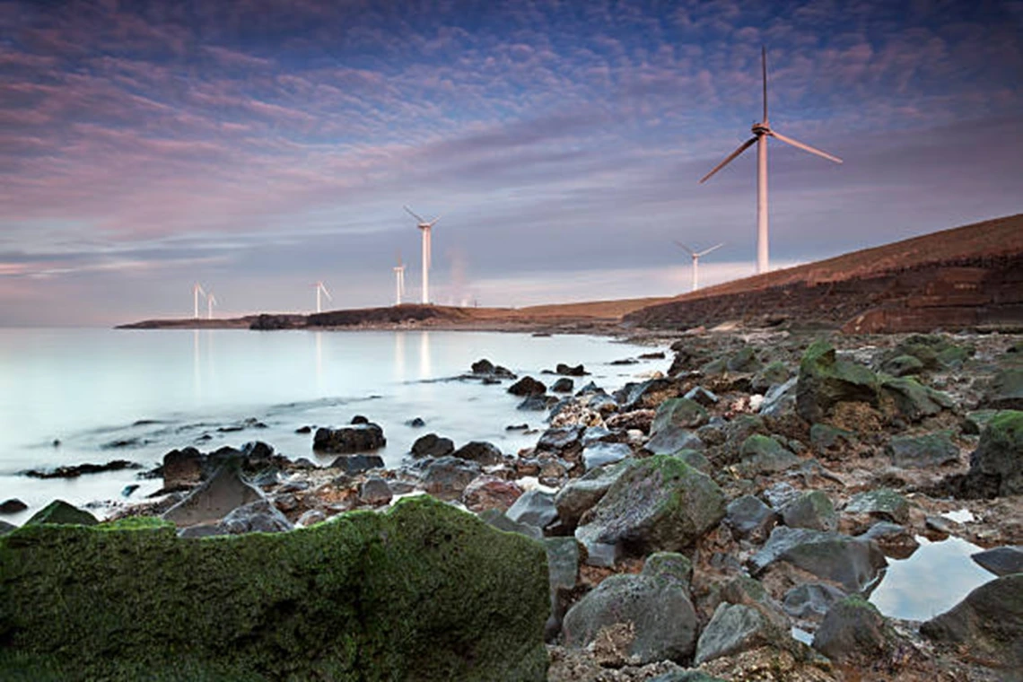 Wind turbines lining the northwest coast of England