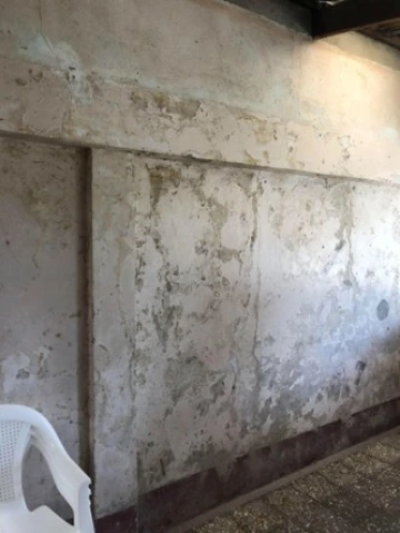 Watermarks and damage left behind by Hurricanes Eta and Iota on the interior walls of the home of a local resident, San Pedro Sula, Honduras.